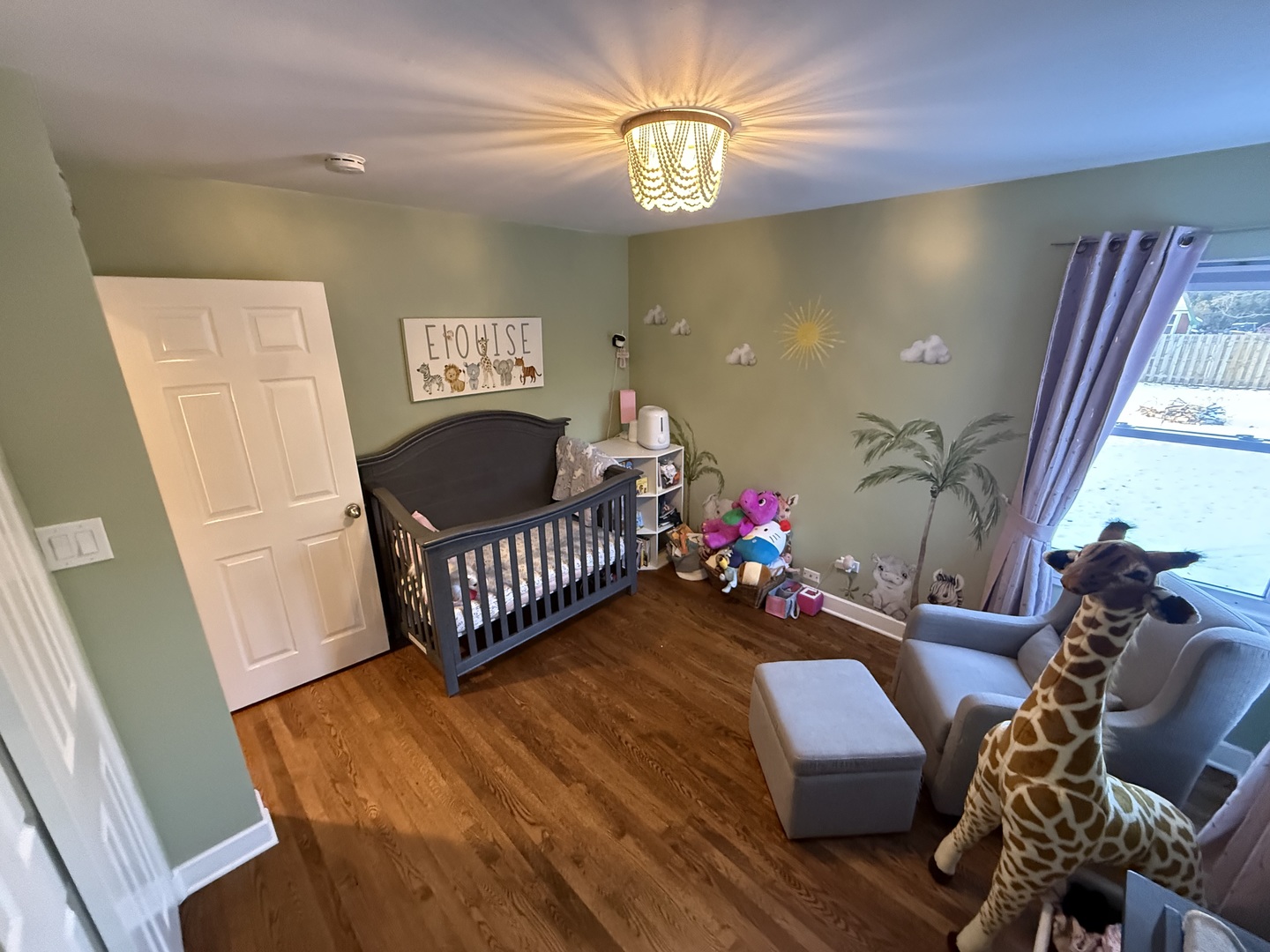 1044 Ellsworth Avenue Addison, IL 60101 - Photo 29 of 45 a living room with furniture and a chandelier