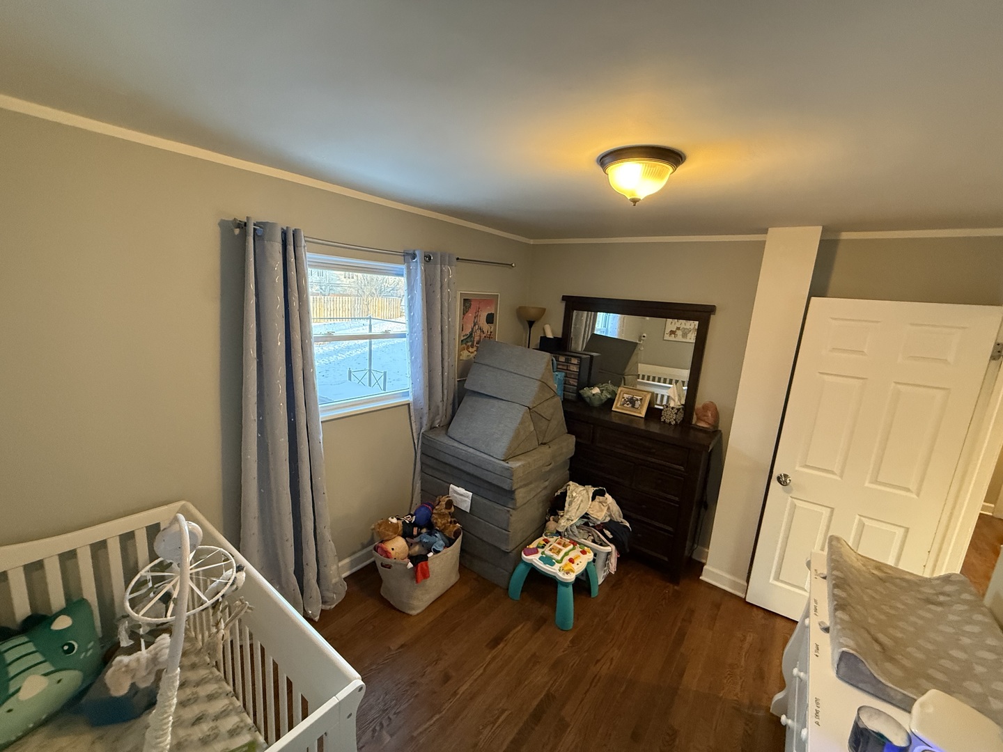 1044 Ellsworth Avenue Addison, IL 60101 - Photo 33 of 45 a living room with furniture and a wooden floor