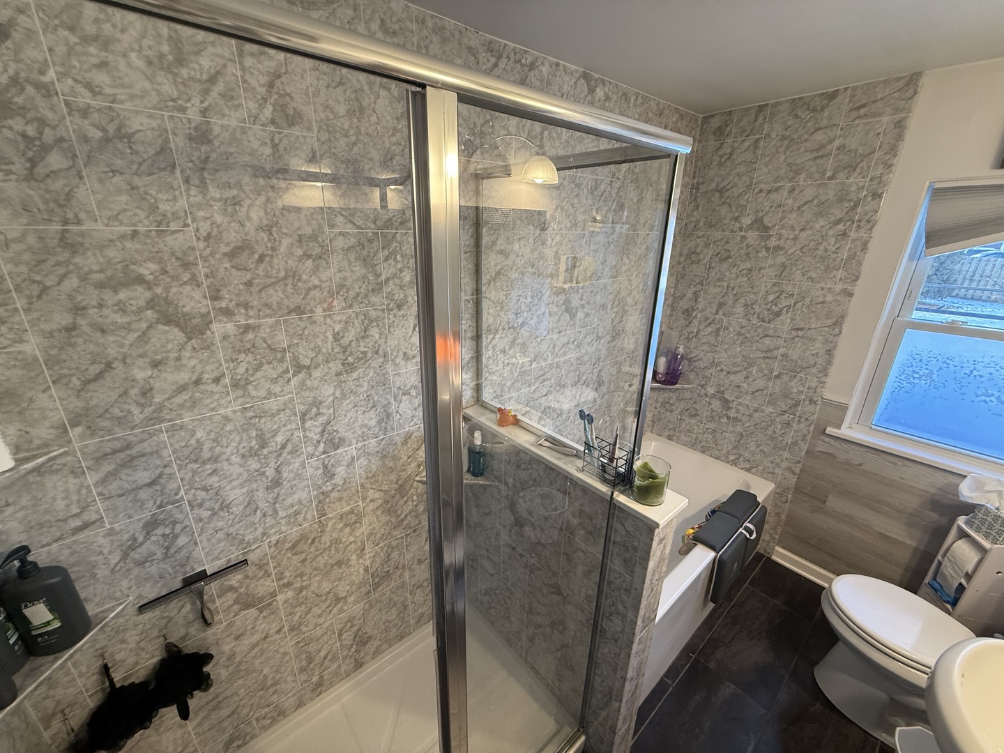 1044 Ellsworth Avenue Addison, IL 60101 - Photo 35 of 45 a bathroom with a granite countertop sink a toilet and a shower