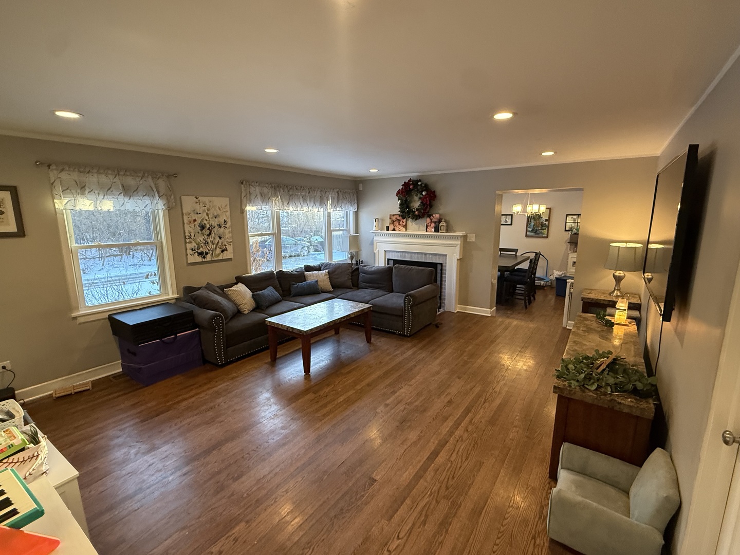 1044 Ellsworth Avenue Addison, IL 60101 - Photo 7 of 45 a living room with furniture flat screen tv and a fireplace