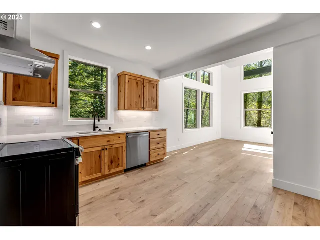 a view of a kitchen with a sink and a window