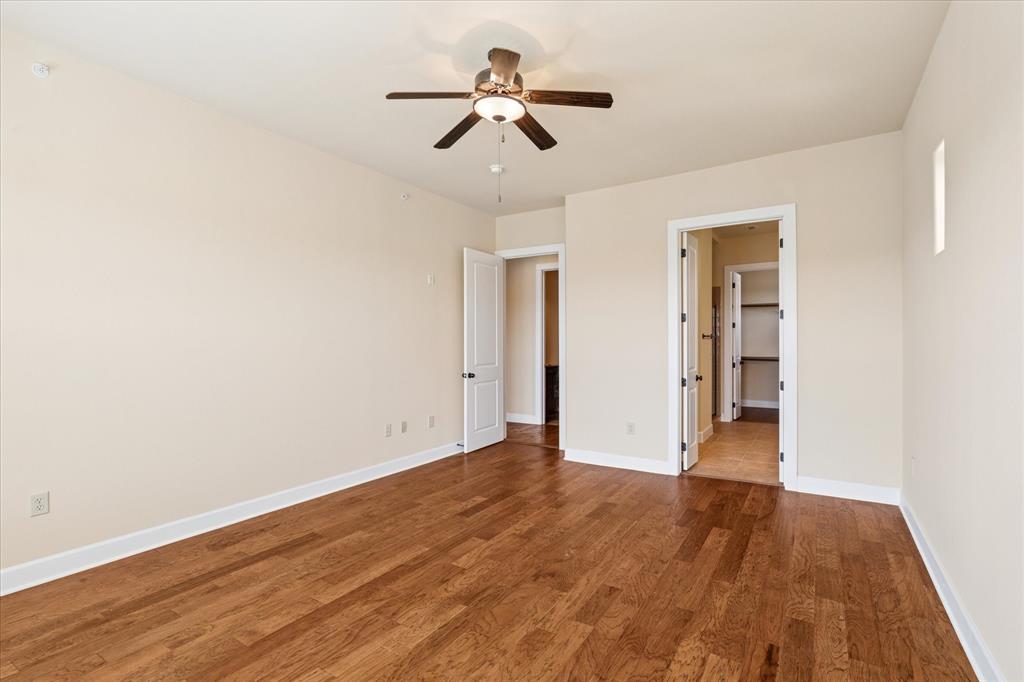 610 Via Ravello, Unit 410 Irving, TX 75039 - Photo 12 of 28 wooden floor in an empty room