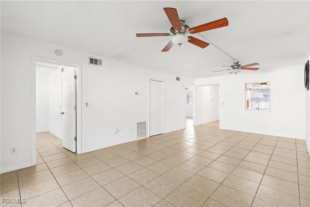 a view of a livingroom with closet and fan