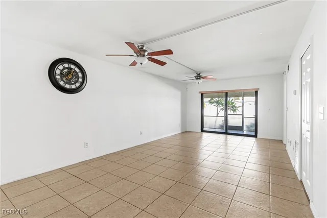a view of an empty room and a window