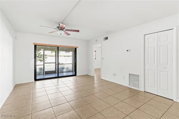 a view of an empty room with a window