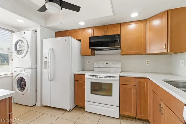 a view of a kitchen with washer and dryer