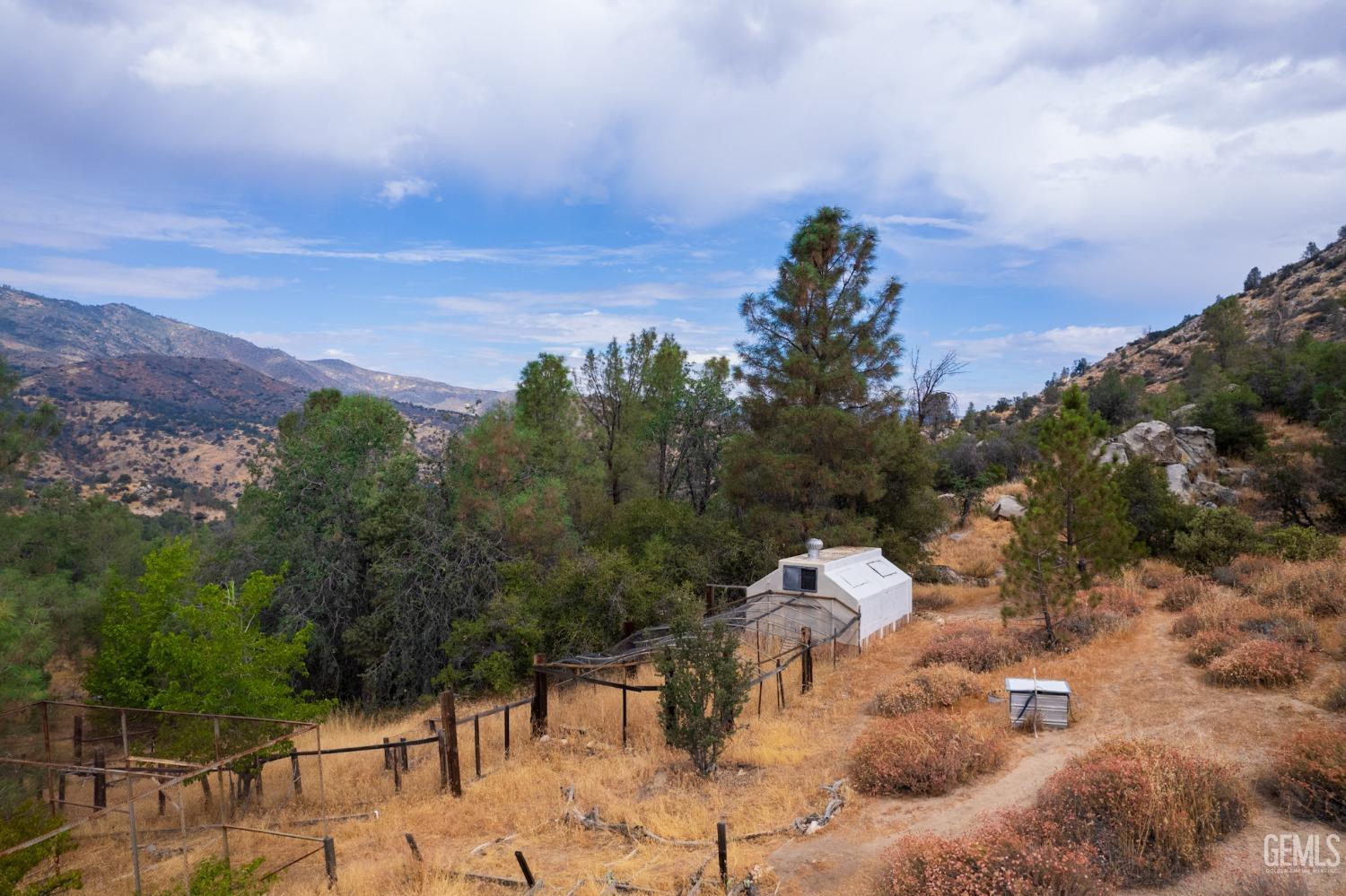 Undisclosed Address Caliente, CA 93518 - Photo 15 of 38 a view of a house with a yard and mountain