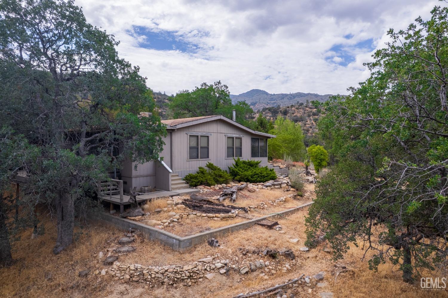 Undisclosed Address Caliente, CA 93518 - Photo 2 of 38 a view of a house with backyard and garden