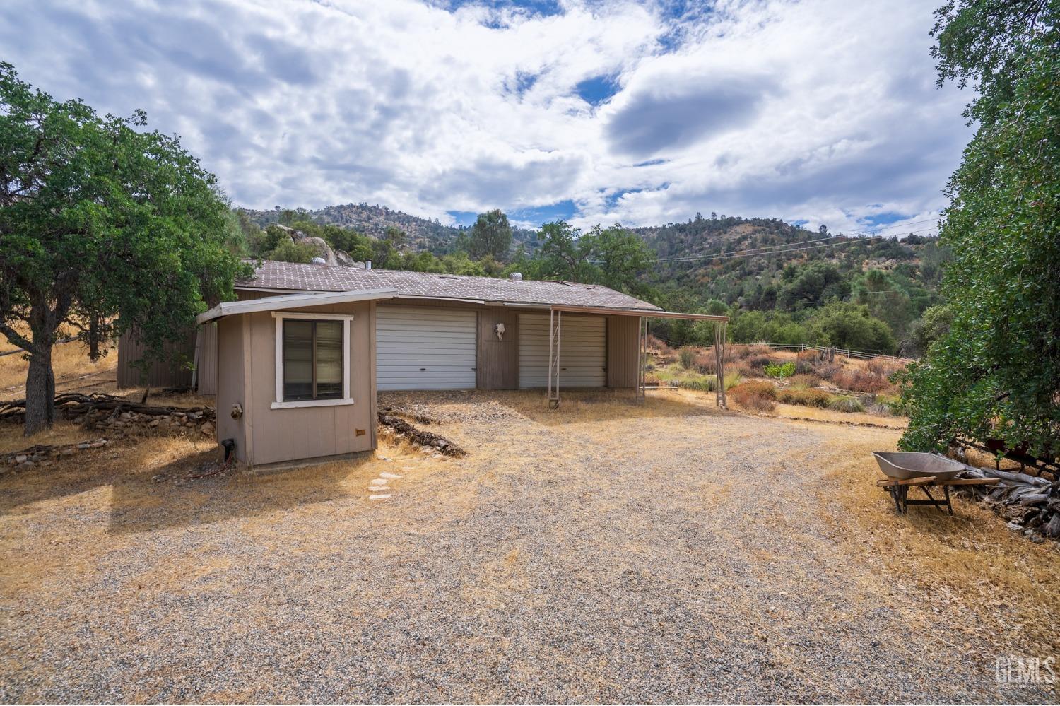 Undisclosed Address Caliente, CA 93518 - Photo 25 of 38 a view of a house with a backyard