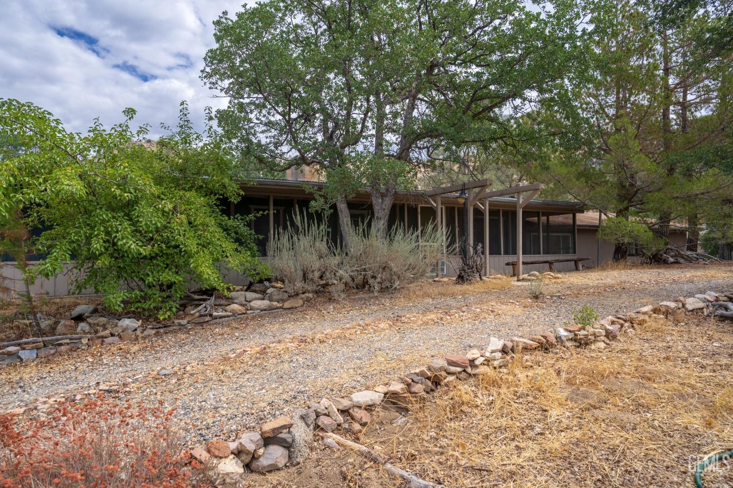 Undisclosed Address Caliente, CA 93518 - Photo 27 of 38 a front view of a house with garden