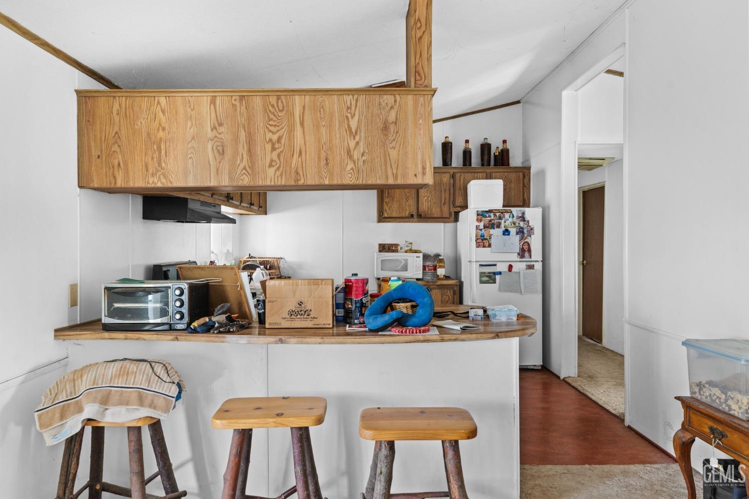 Undisclosed Address Caliente, CA 93518 - Photo 36 of 38 a kitchen with stainless steel appliances granite countertop a refrigerator and microwave