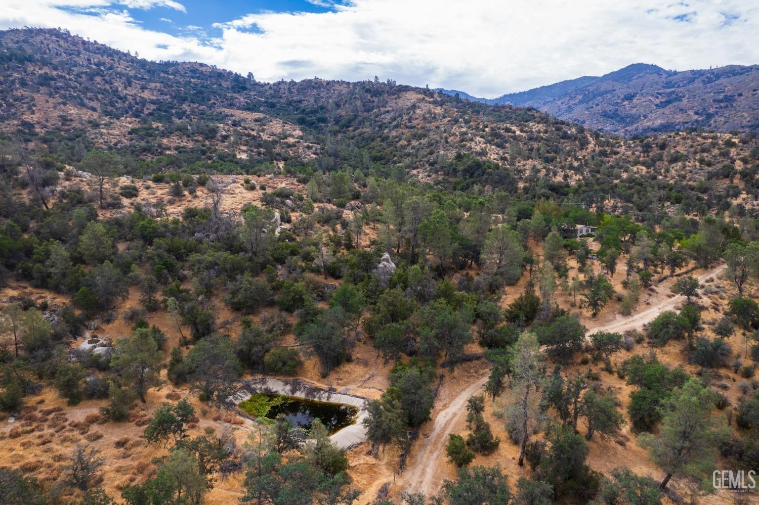 Undisclosed Address Caliente, CA 93518 - Photo 8 of 38 an aerial view of residential house and green space