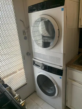 a utility room with dryer and washer