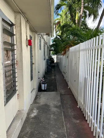 a view of a potted plants on a sidewalk