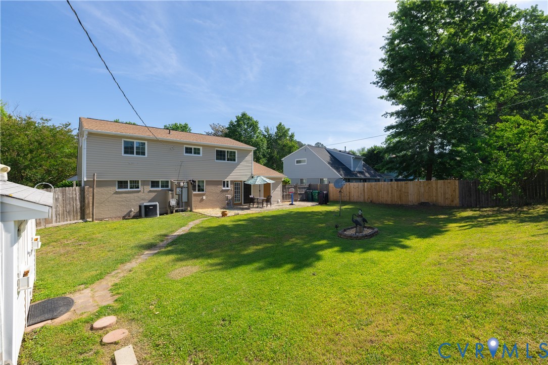 9217 Fisk Road Richmond, VA 23229 - Photo 34 of 39 a view of backyard with a garden and deck