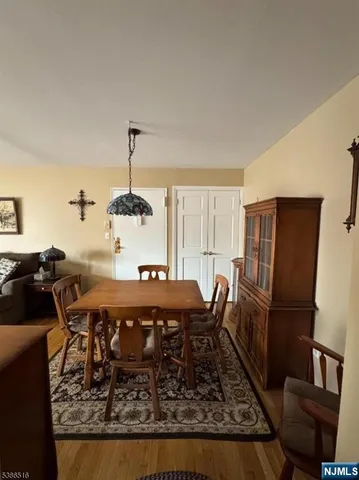 a room with furniture pool table and flat screen tv