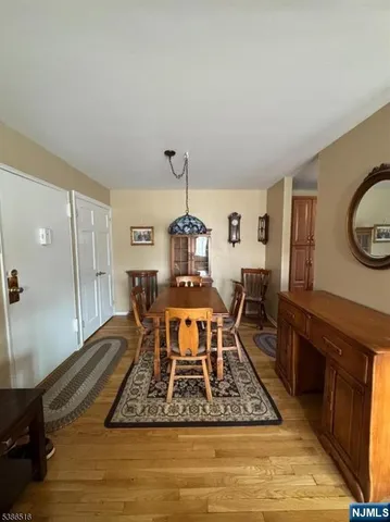a bathroom with a sink a toilet a mirror a vanity and bathtub