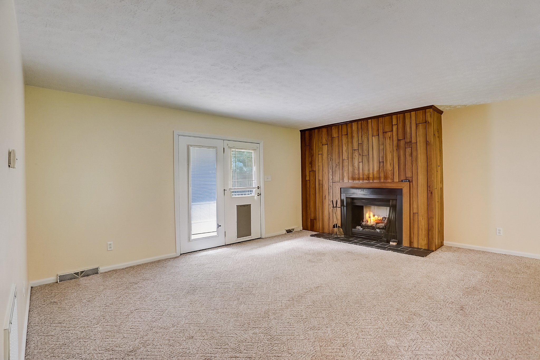 112 Lee Road Dickson, TN 37055 - Photo 4 of 29 a view of an empty room with a fireplace and a window