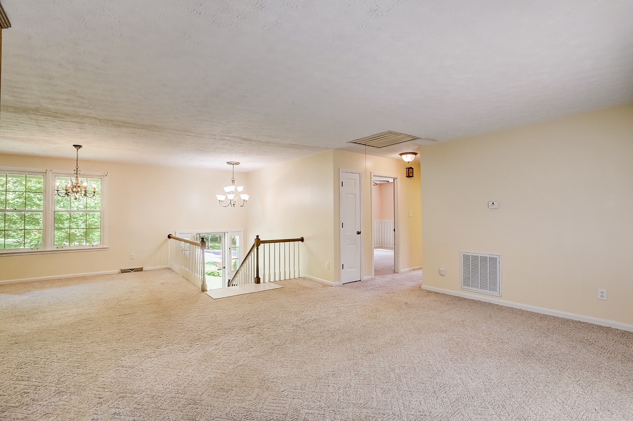112 Lee Road Dickson, TN 37055 - Photo 6 of 29 an empty room with chandelier fan and windows