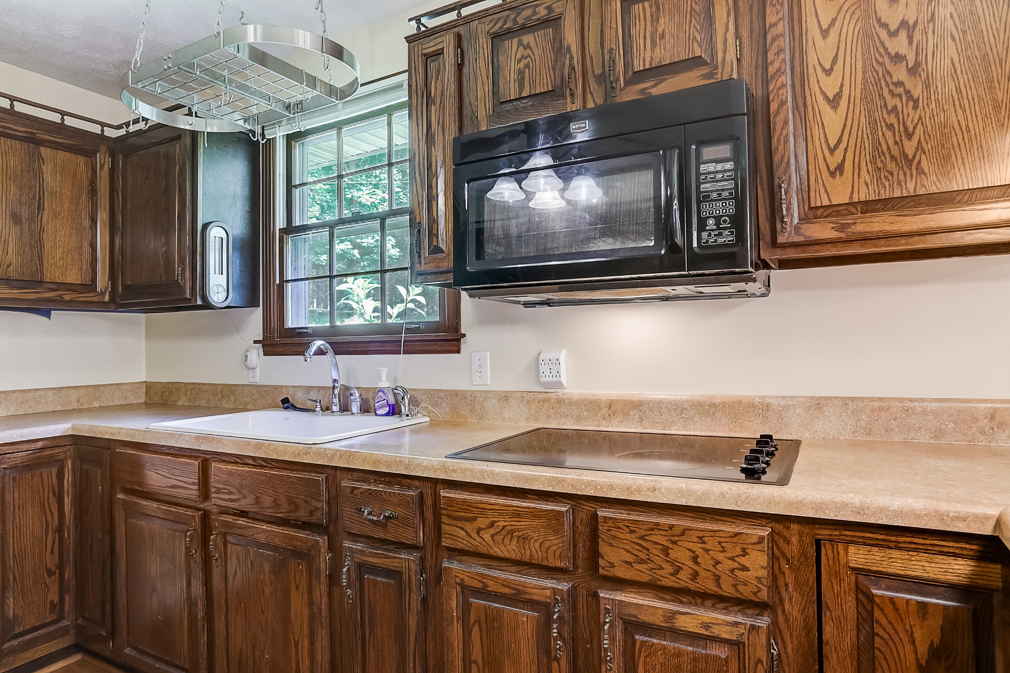112 Lee Road Dickson, TN 37055 - Photo 8 of 29 a kitchen with a sink cabinets and a wooden floor