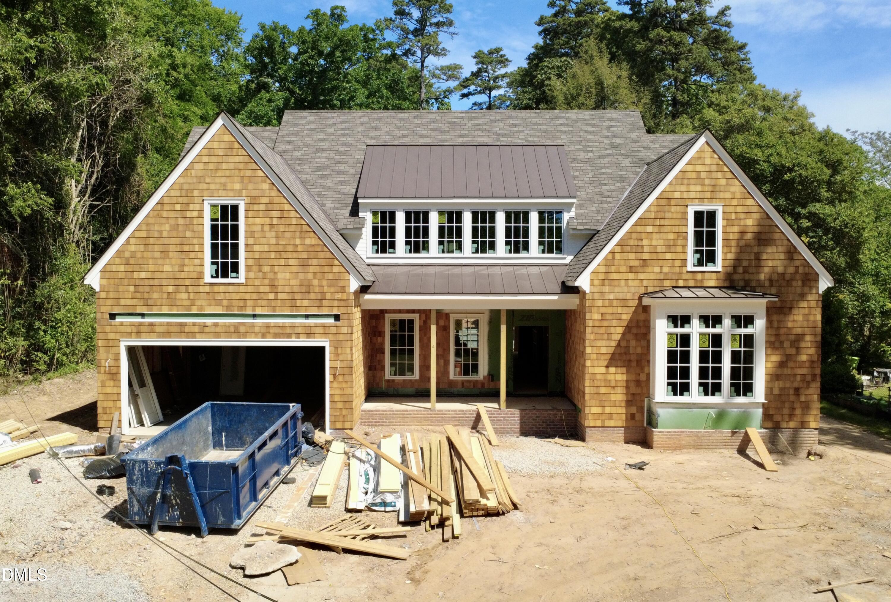 a view of house with yard outdoor seating and barbeque oven