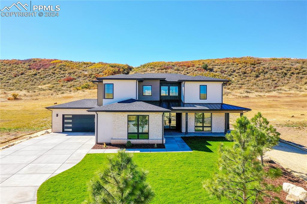 front view of a house with a yard