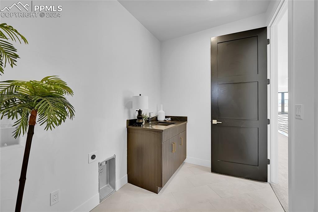 5549 Remuda Ranch Parkway Sedalia, CO 80135 - Photo 23 of 39 a kitchen with a refrigerator and a potted plant