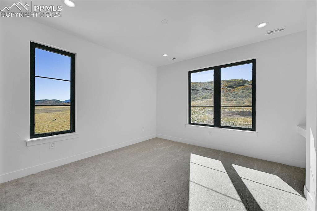 5549 Remuda Ranch Parkway Sedalia, CO 80135 - Photo 27 of 39 an empty room with a window