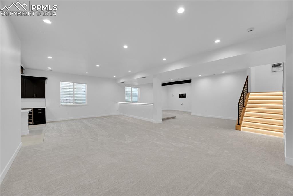 5549 Remuda Ranch Parkway Sedalia, CO 80135 - Photo 29 of 39 a view of an empty room with window and wooden floor