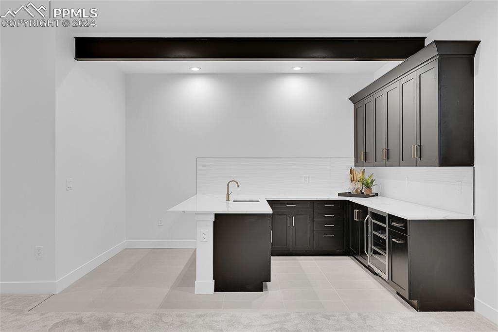 5549 Remuda Ranch Parkway Sedalia, CO 80135 - Photo 30 of 39 a kitchen with a sink and cabinets