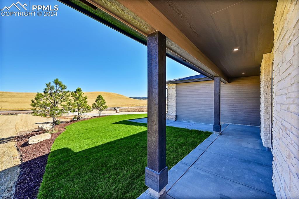 5549 Remuda Ranch Parkway Sedalia, CO 80135 - Photo 3 of 39 a view of a porch