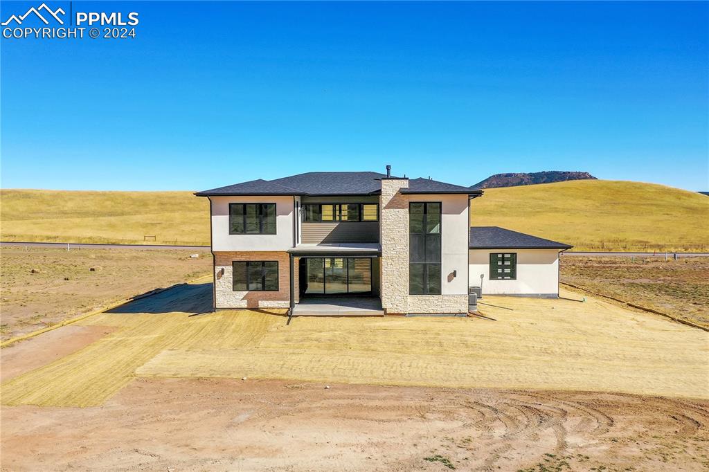 5549 Remuda Ranch Parkway Sedalia, CO 80135 - Photo 37 of 39 a front view of a building with an ocean view