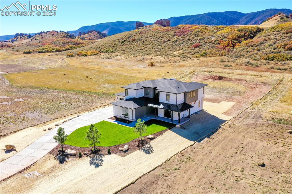 5549 Remuda Ranch Parkway Sedalia, CO 80135 - Photo 38 of 39 a view of a ocean with a mountain