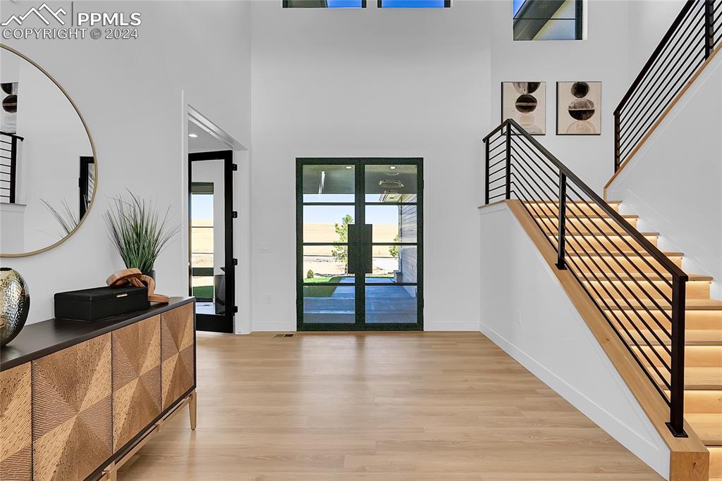 5549 Remuda Ranch Parkway Sedalia, CO 80135 - Photo 4 of 39 a view of an entryway with wooden floor and door