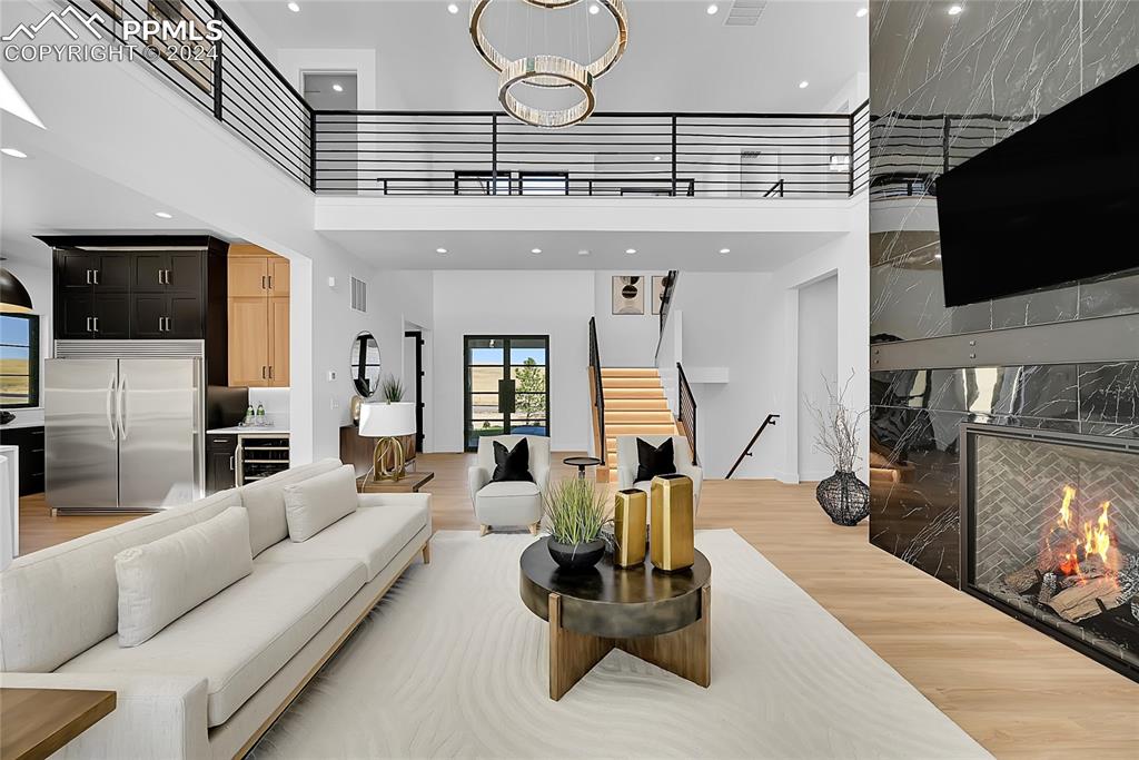 5549 Remuda Ranch Parkway Sedalia, CO 80135 - Photo 7 of 39 a living room with furniture and a flat screen tv