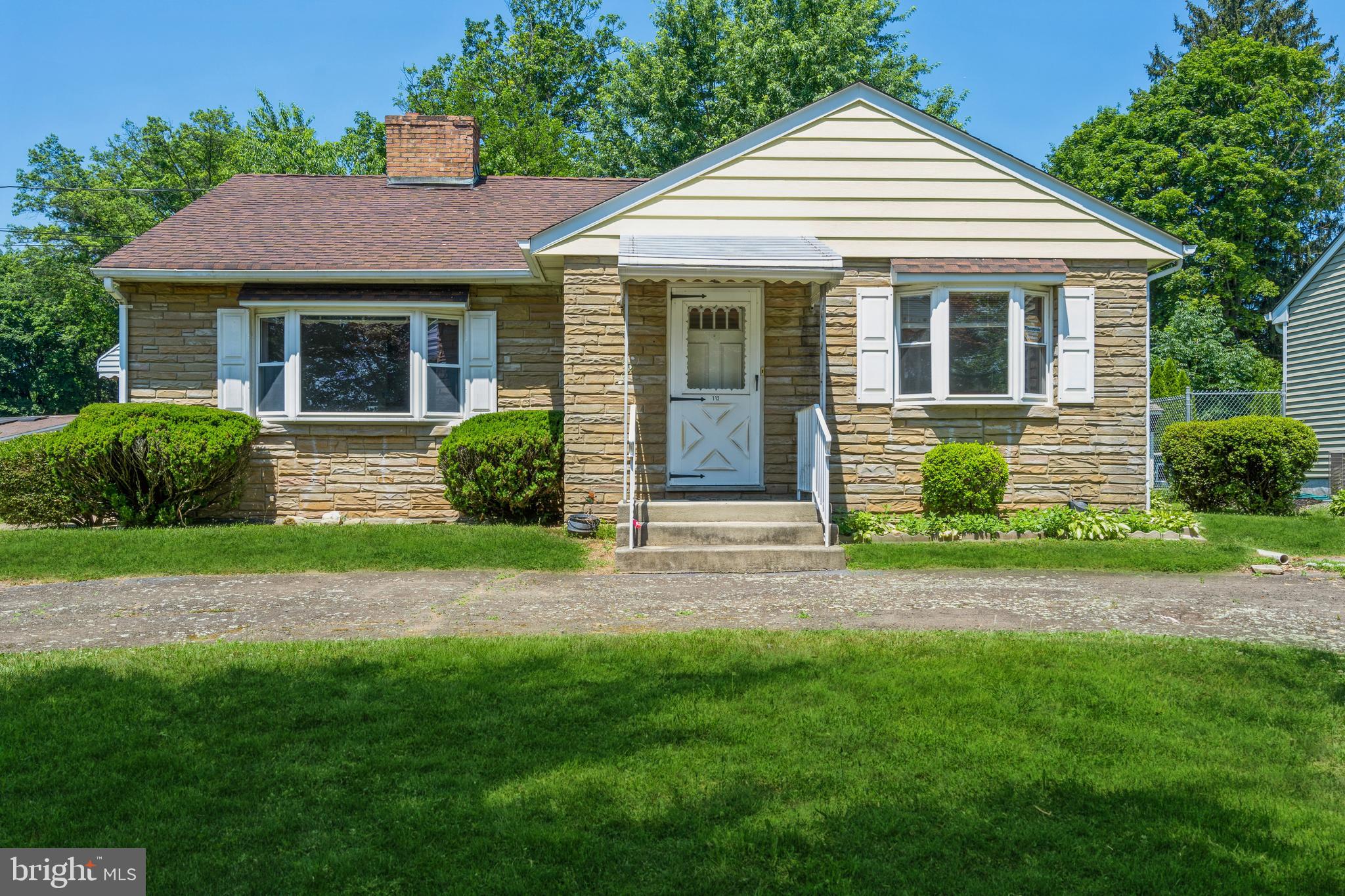 112 Wilburtha Road Ewing, NJ 08628 - Photo 1 of 21 a front view of a house with a garden