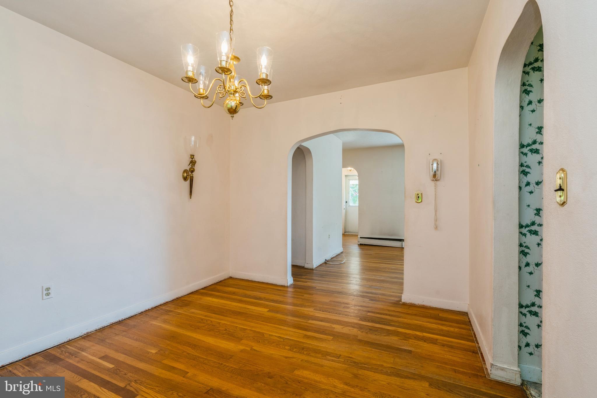 112 Wilburtha Road Ewing, NJ 08628 - Photo 7 of 21 a view of a livingroom with a chandelier fan and wooden floor
