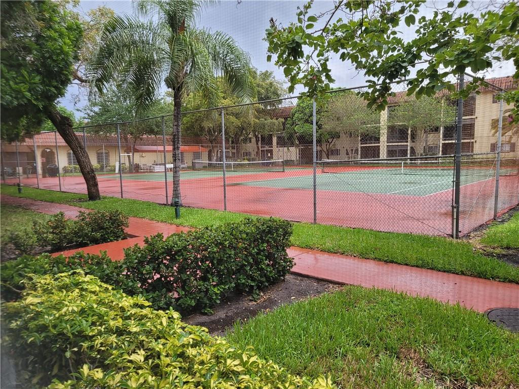 251 South Cypress Road, Unit 112 Pompano Beach, FL 33060 - Photo 11 of 20 a view of a park with large trees