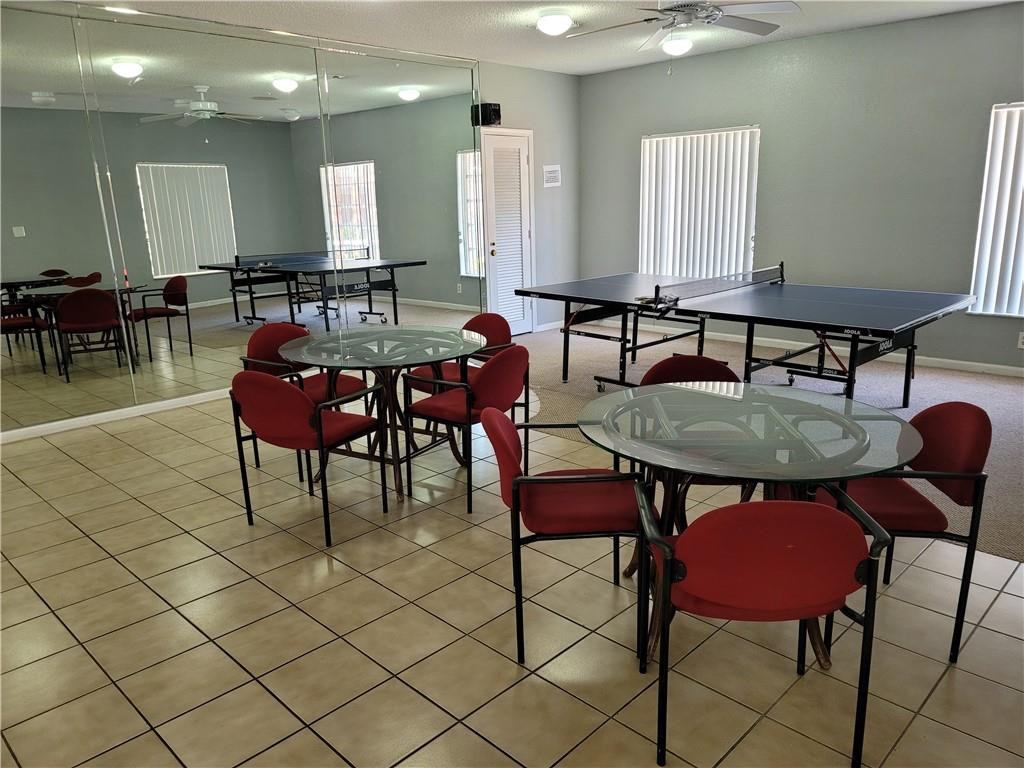 251 South Cypress Road, Unit 112 Pompano Beach, FL 33060 - Photo 19 of 20 a dinning table and chairs in a room