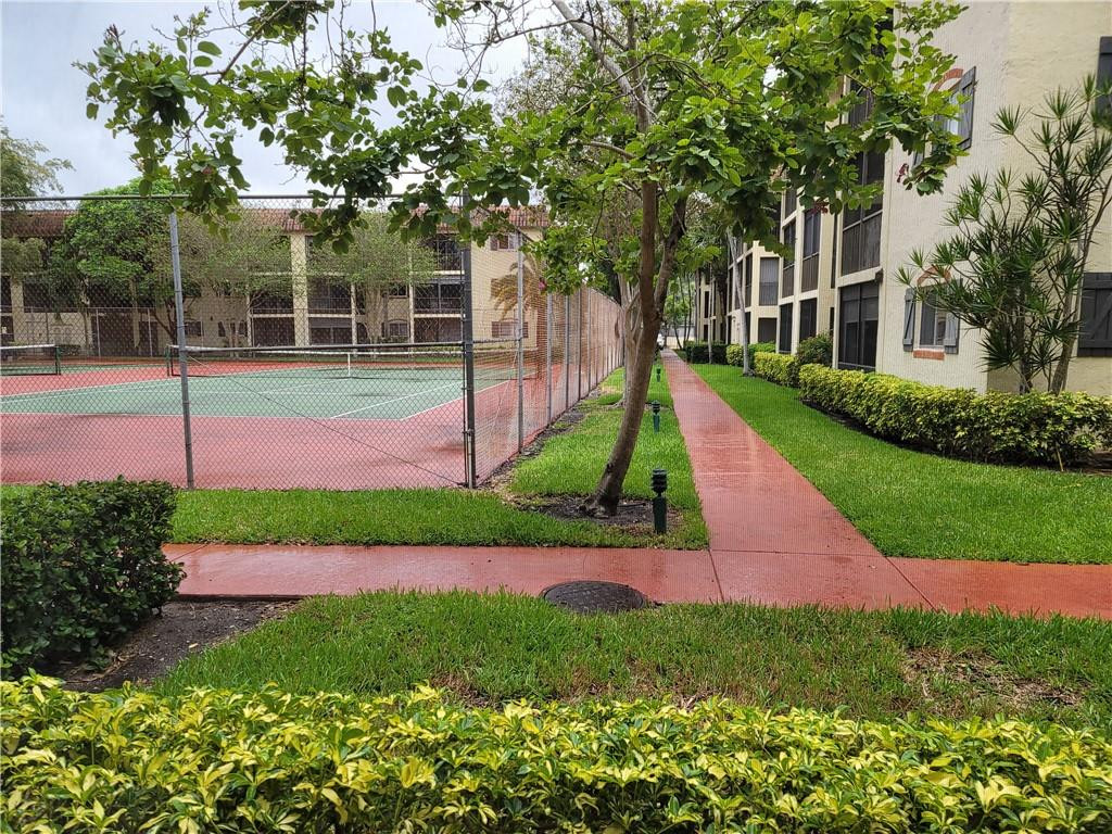 251 South Cypress Road, Unit 112 Pompano Beach, FL 33060 - Photo 3 of 20 a view of backyard with green space
