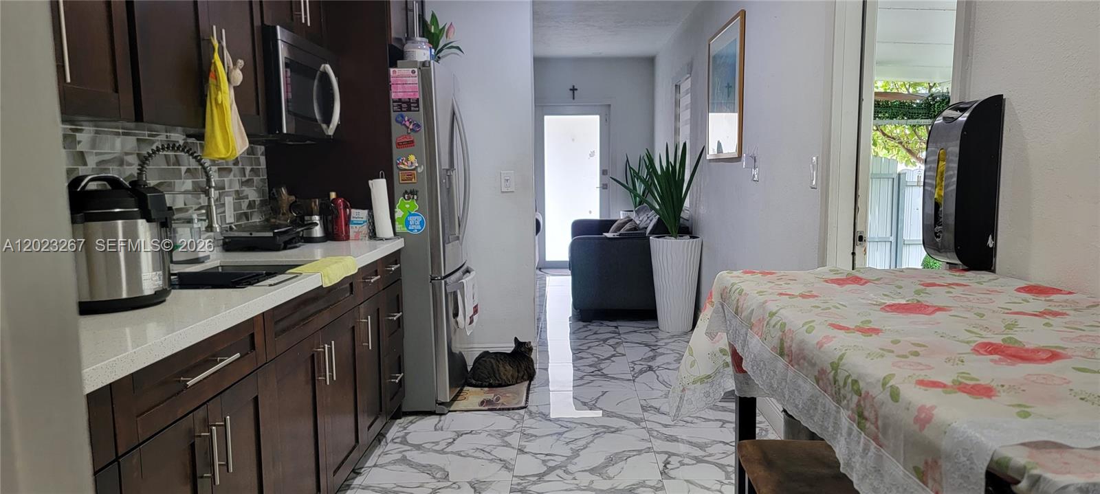 301 Southwest 36th Avenue Miami, FL 33135 - Photo 7 of 32 a bedroom with a bed dresser and a potted plant