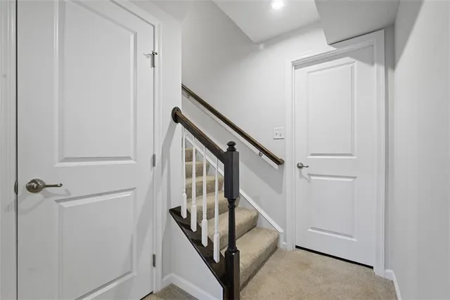 a view of a hallway with staircase