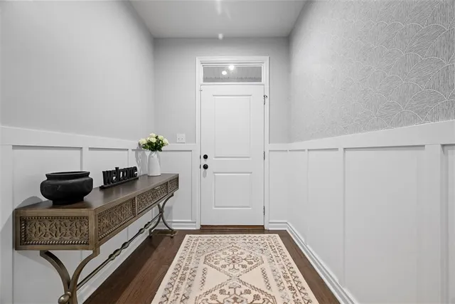 a living room with furniture and a rug