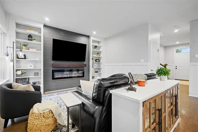 a view of a livingroom with furniture and a flat screen tv