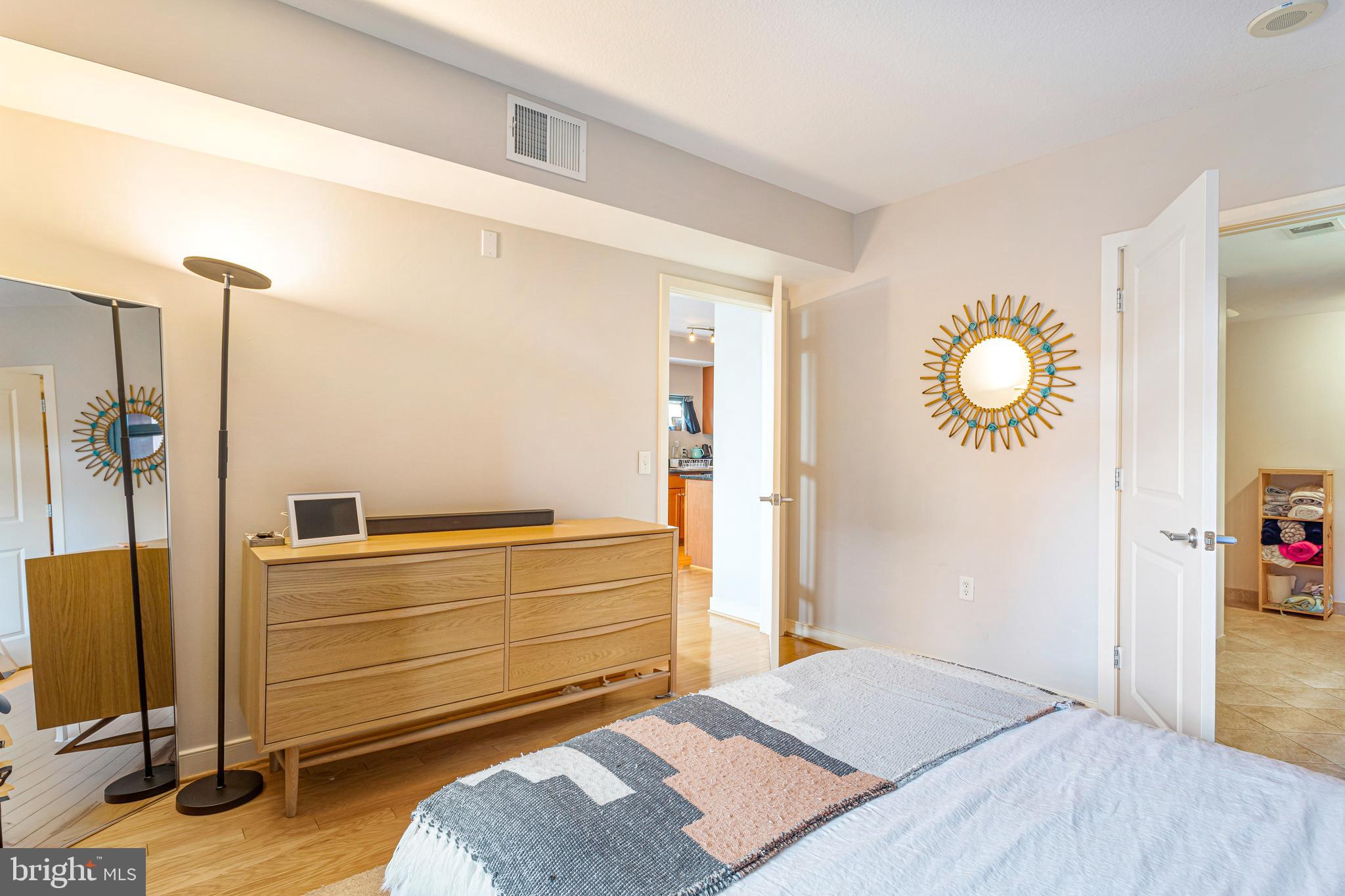 1117 10th Street Northwest, Unit 804 Washington, DC 20001 - Photo 22 of 46 a bedroom with a bed and a table