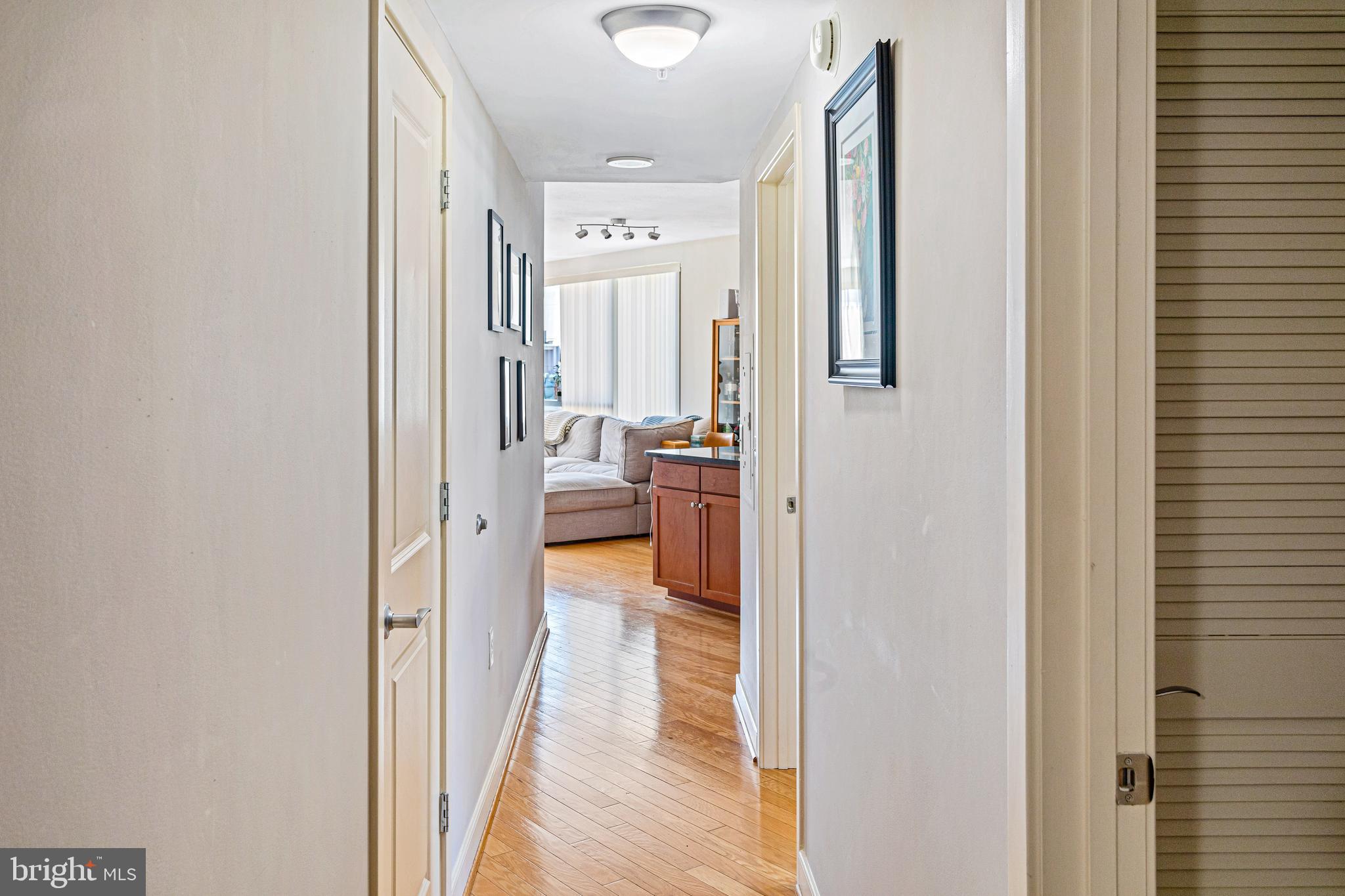 1117 10th Street Northwest, Unit 804 Washington, DC 20001 - Photo 30 of 46 a view of a living room with a wooden floor