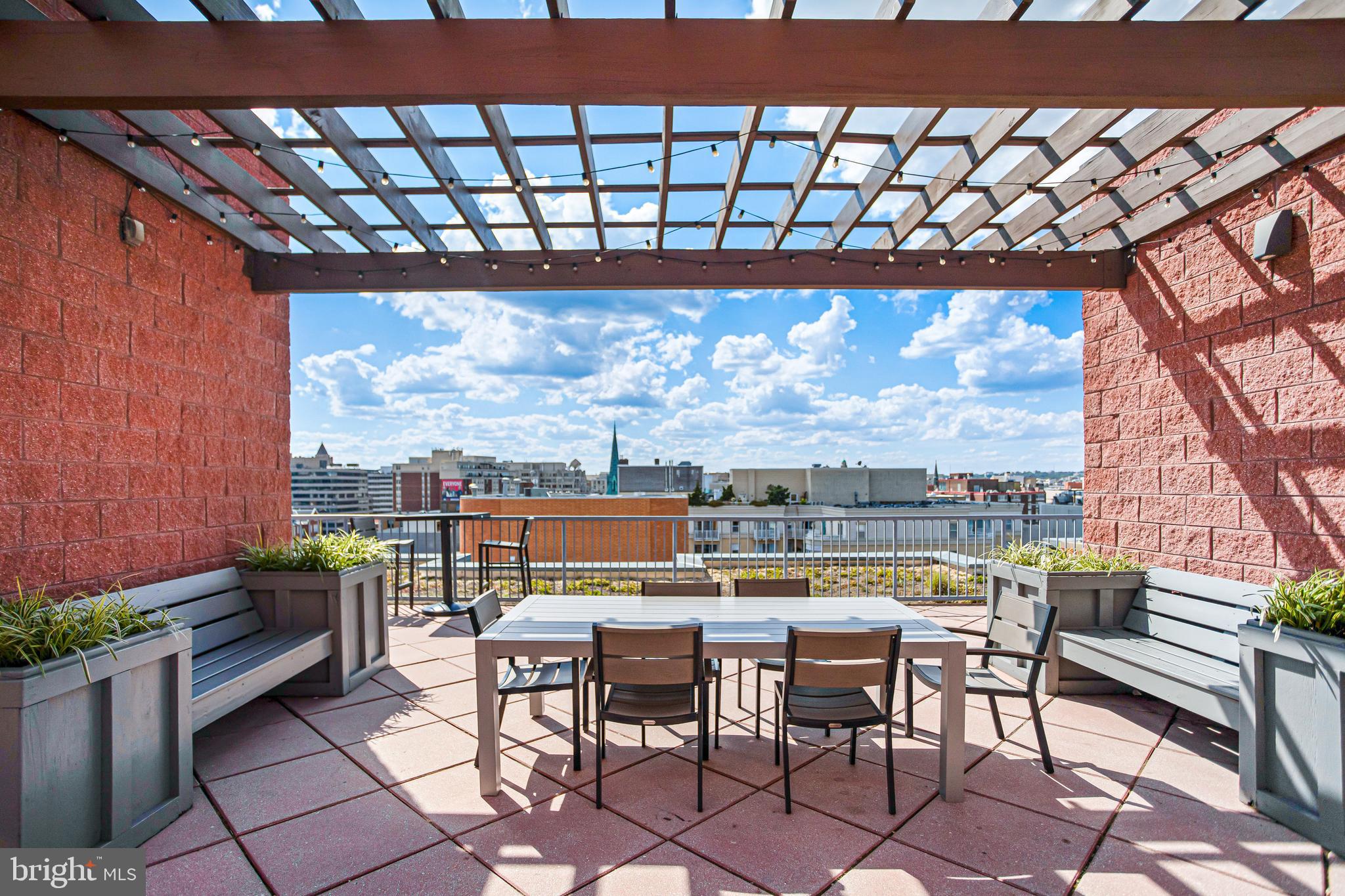 1117 10th Street Northwest, Unit 804 Washington, DC 20001 - Photo 40 of 46 a view of a chairs and table in the terrace