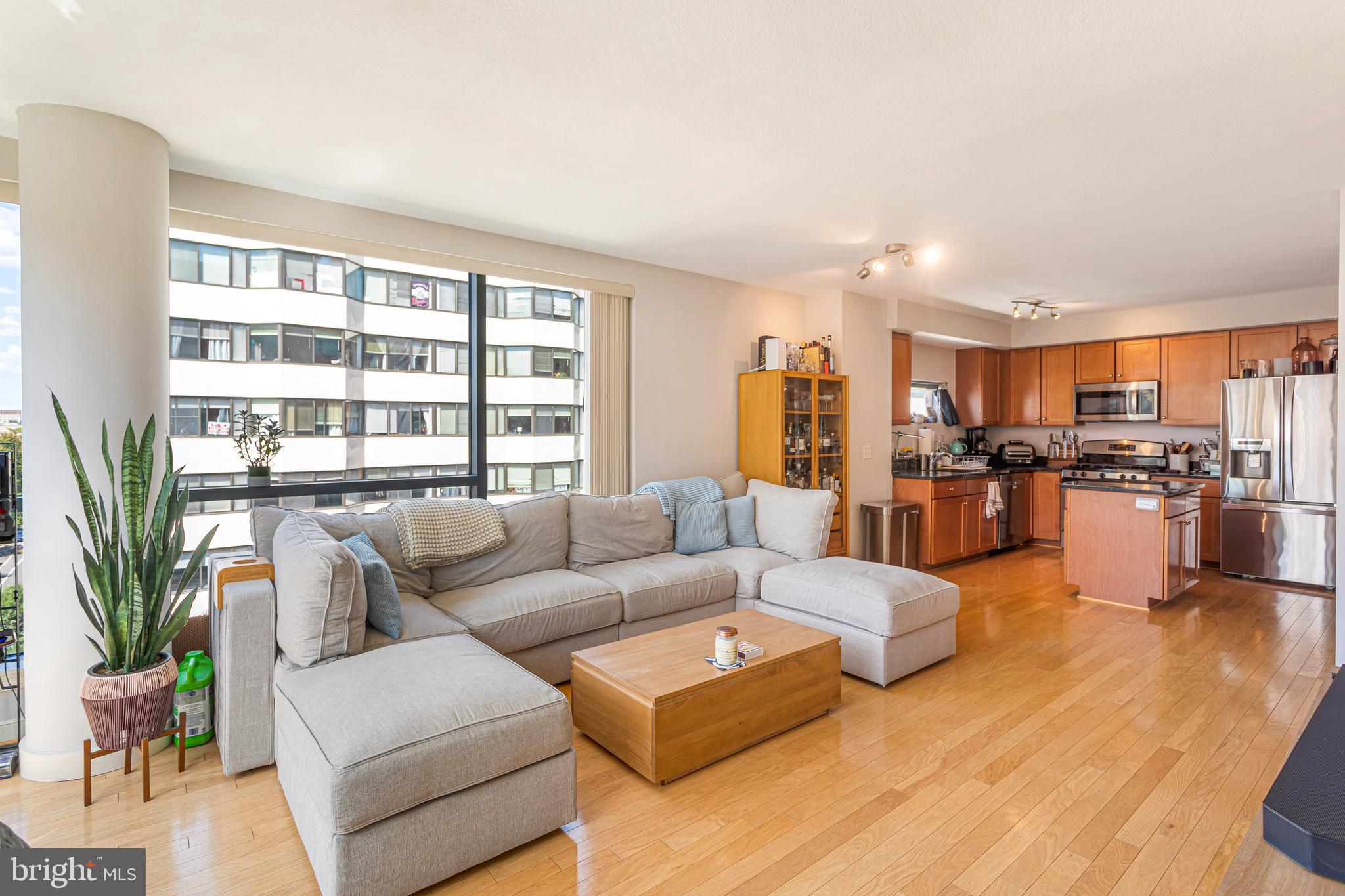 1117 10th Street Northwest, Unit 804 Washington, DC 20001 - Photo 10 of 46 a living room with furniture and a large window