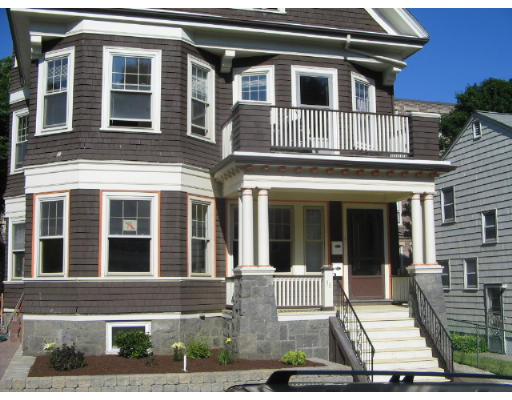 99 Parkton Road, Unit 1 Boston, MA 02130 - Photo 13 of 16 a front view of a house with a yard