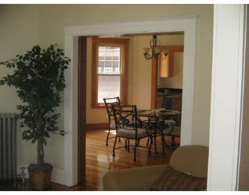 99 Parkton Road, Unit 1 Boston, MA 02130 - Photo 4 of 16 a view of a livingroom with furniture and a potted plant
